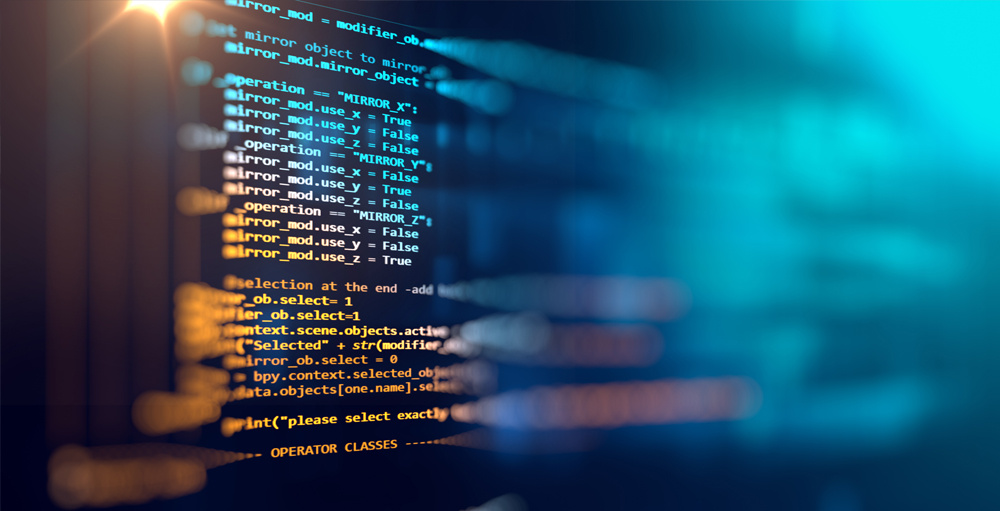 Symbol für Softwareentwicklung. Das Bild zeigt einen Computerbildschirm. Auf dem Bildschirm ist ein Auszug eines Programmcodes zu erkennen.