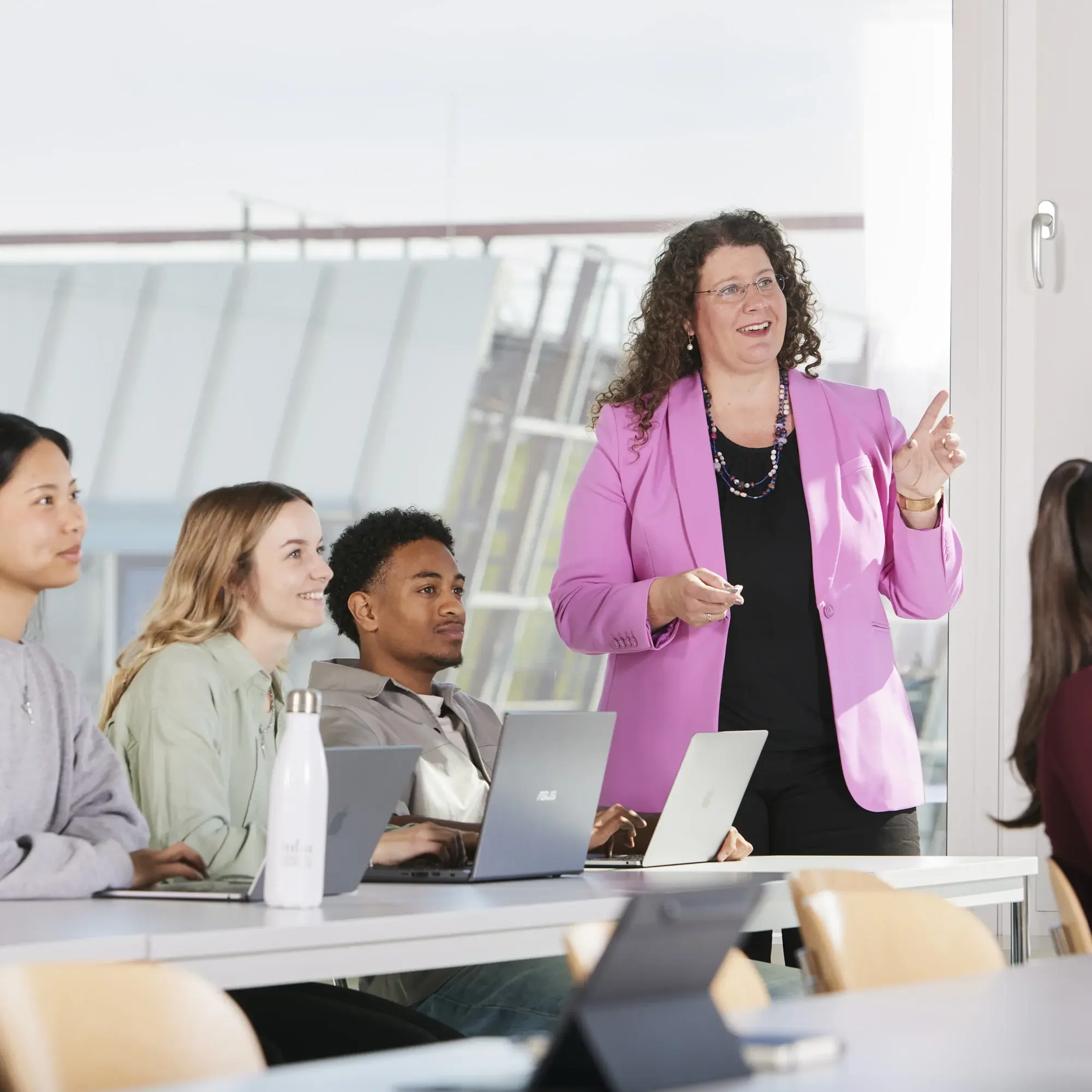 A female professor teaching a lecture.