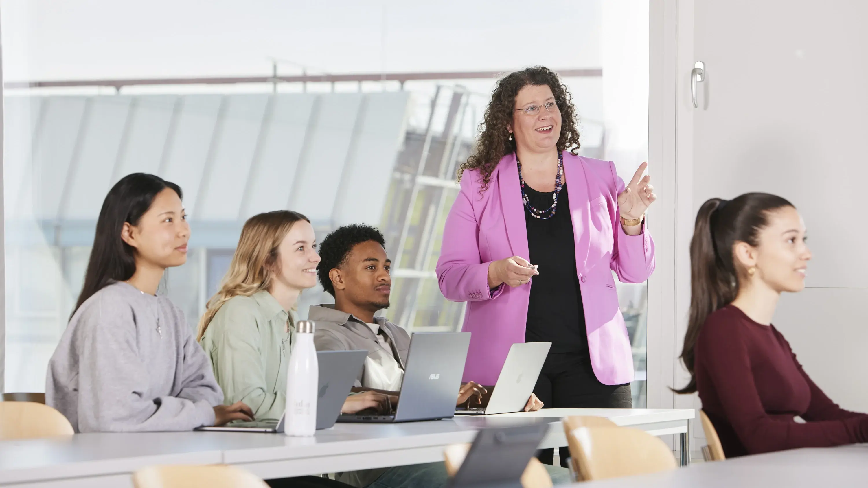 A female professor teaching a lecture.
