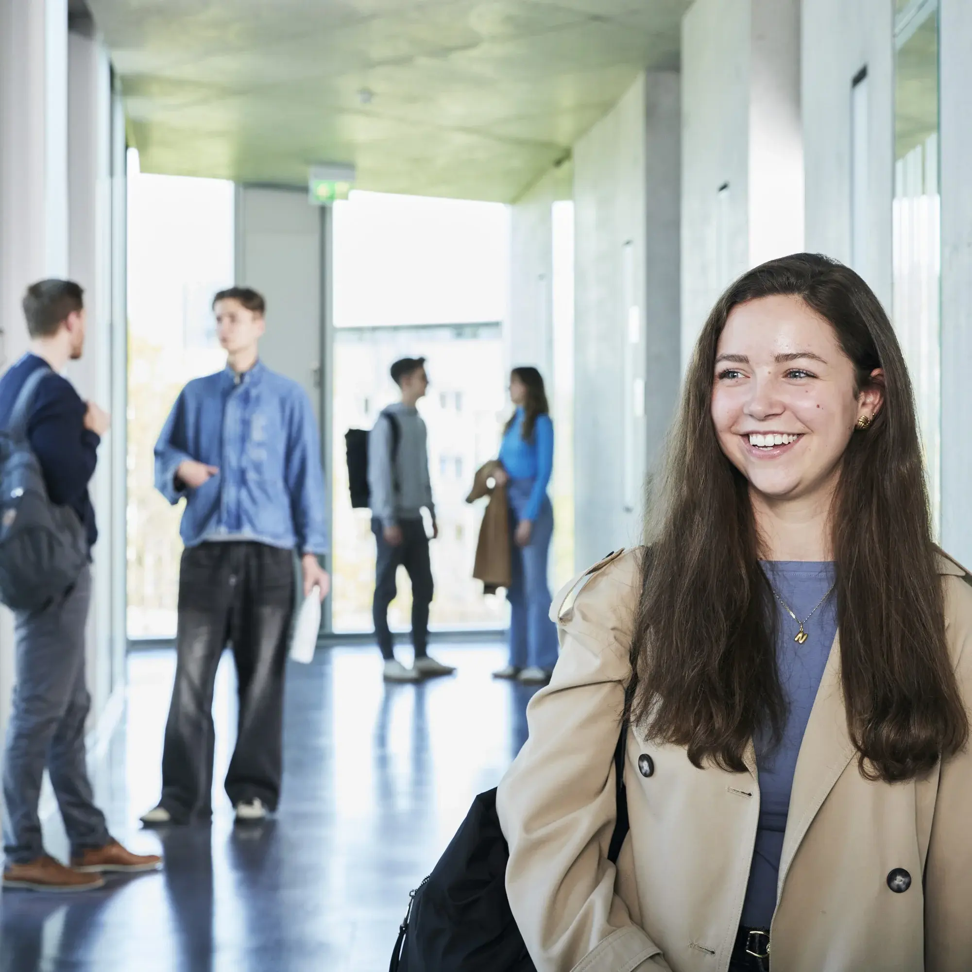 Students walking through the corridors of the Hochschule der Medien..