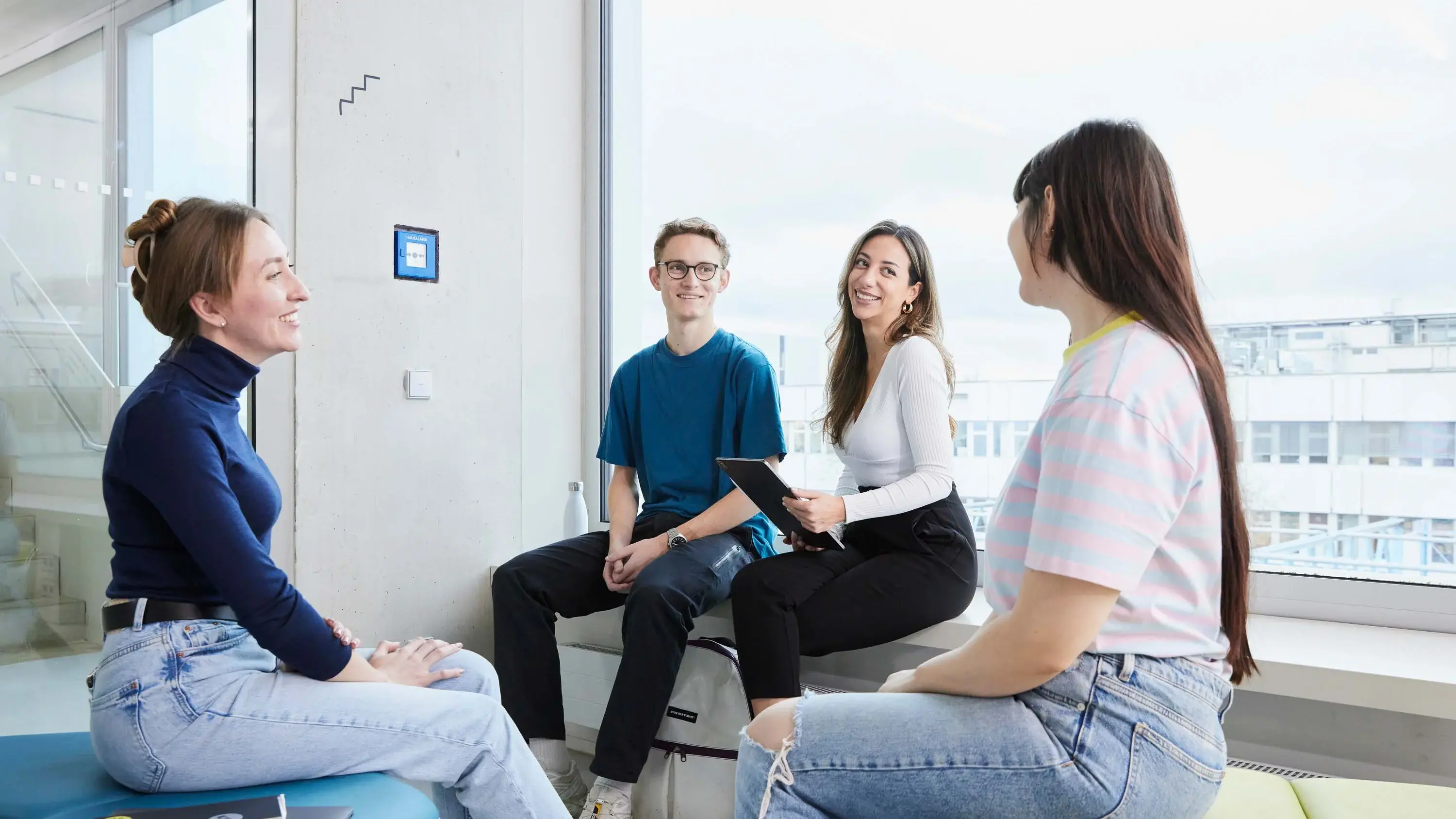 Students discuss in a small group.
