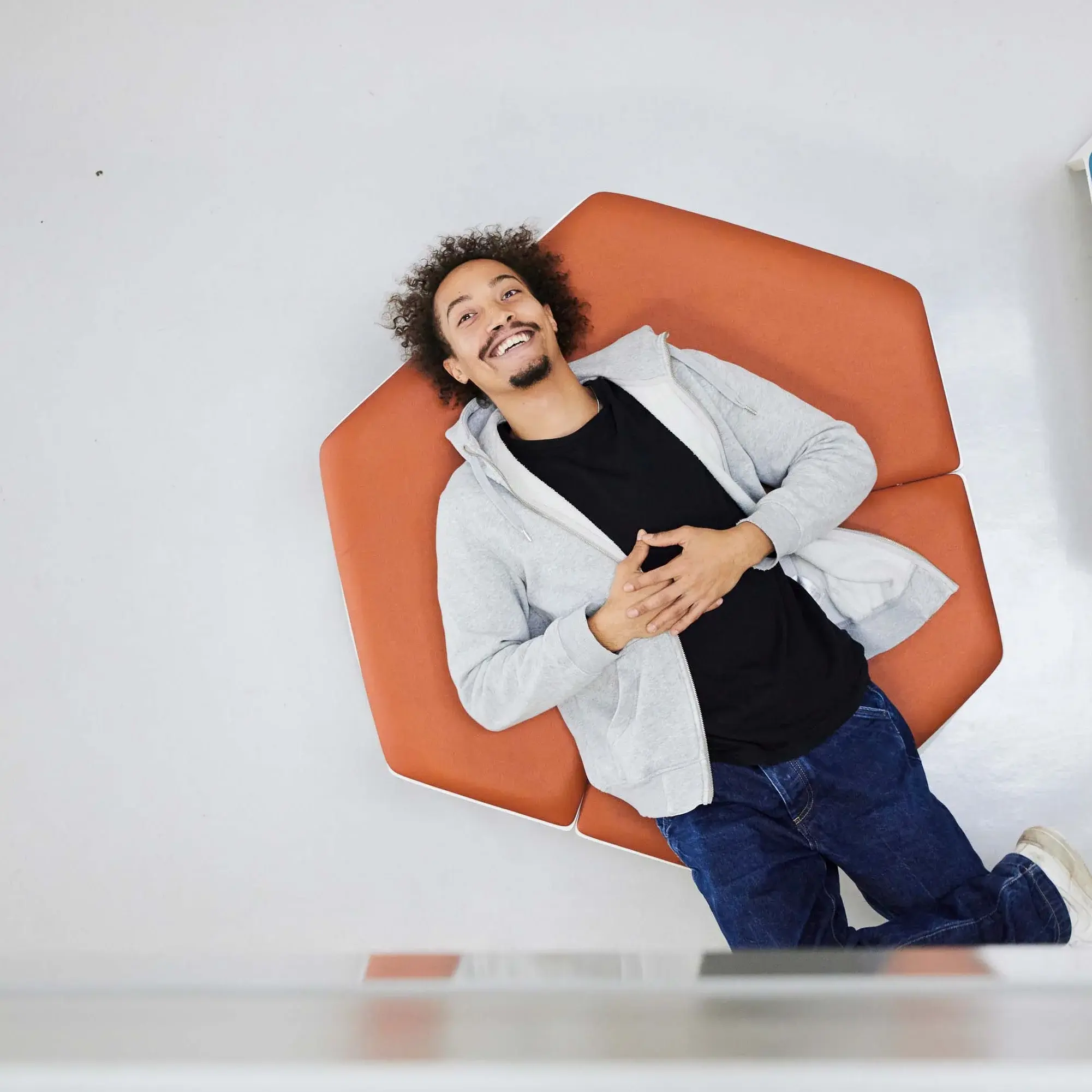 A student takes a break on some seating.