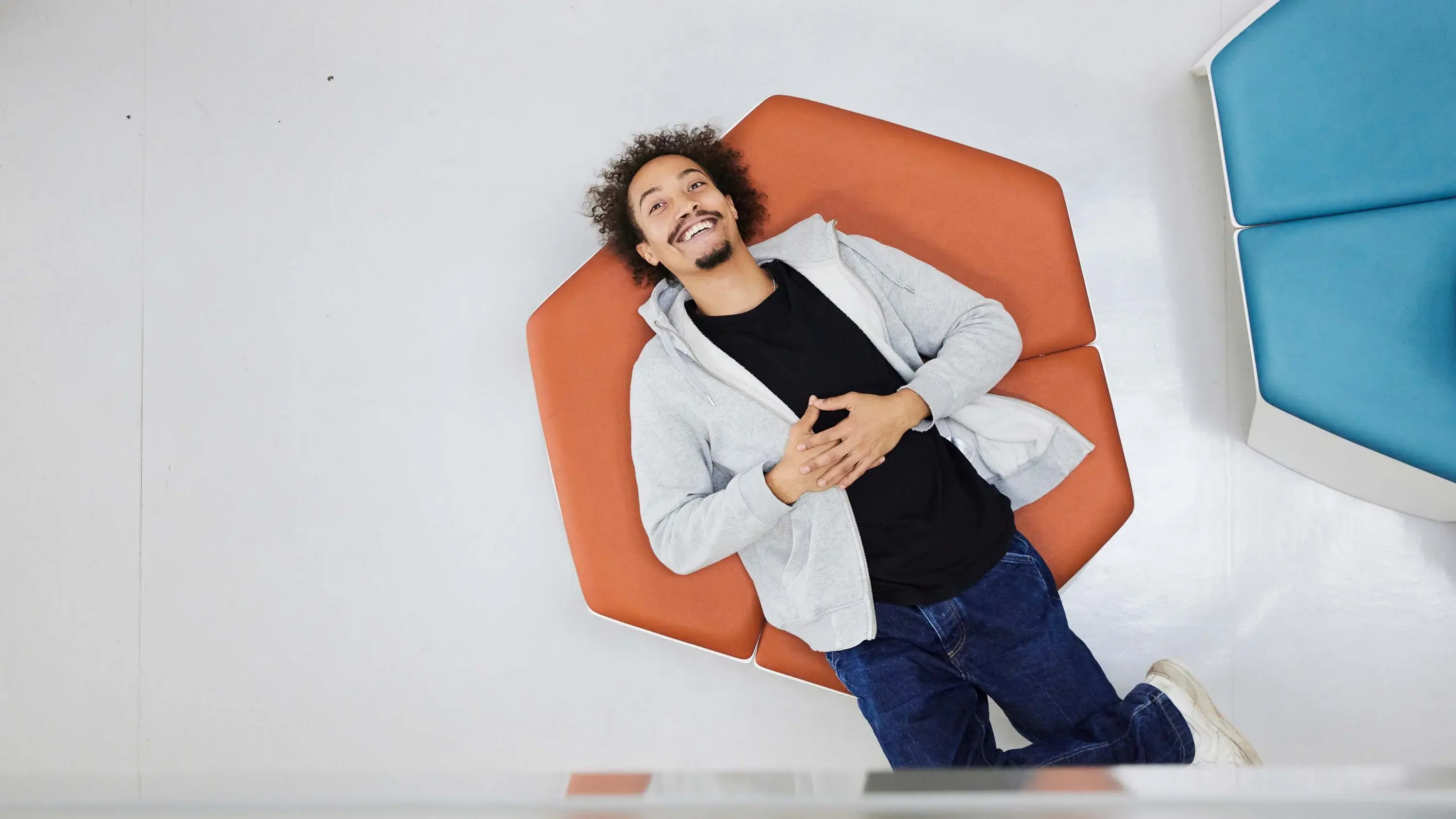 A student takes a break on some seating.