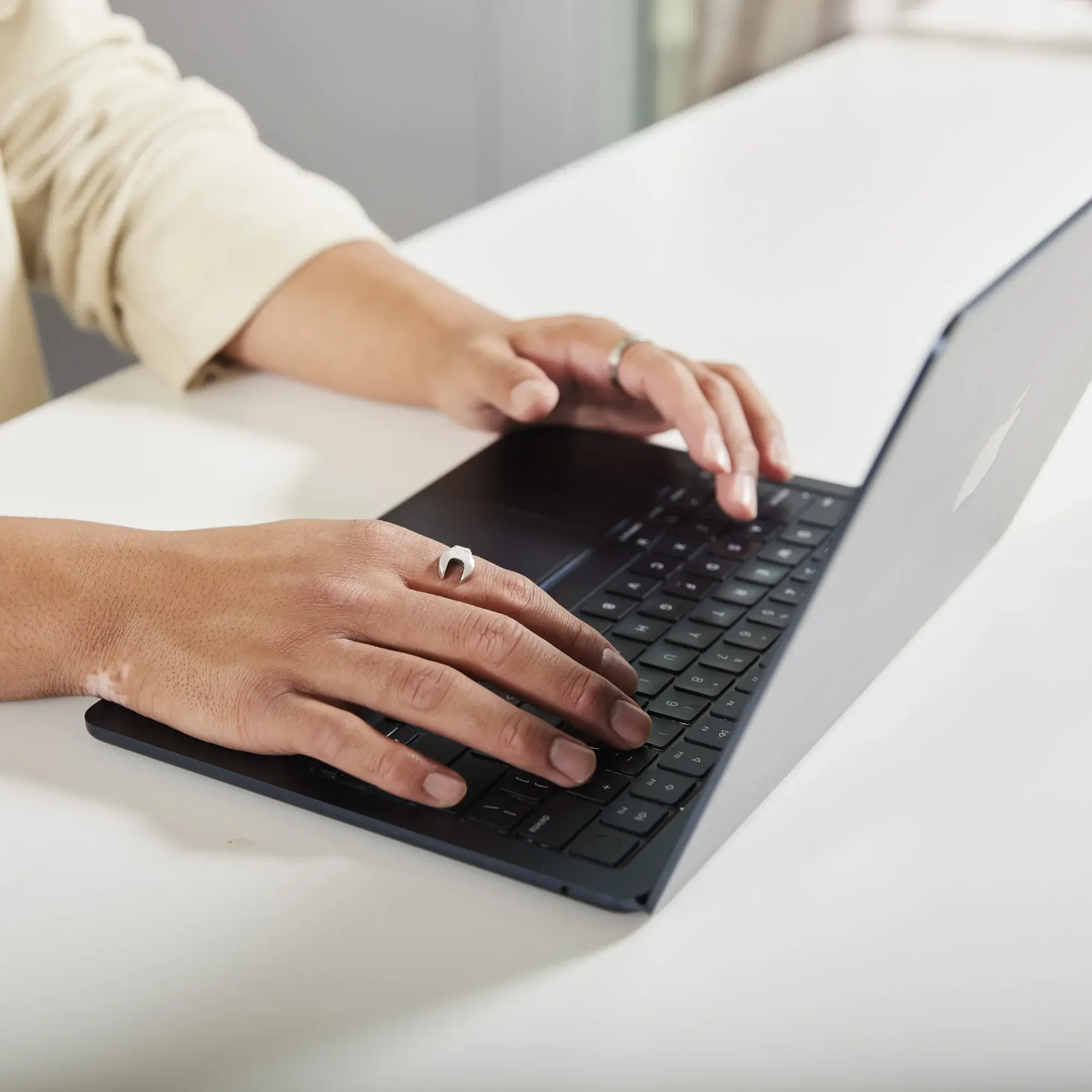 A person working on a laptop.