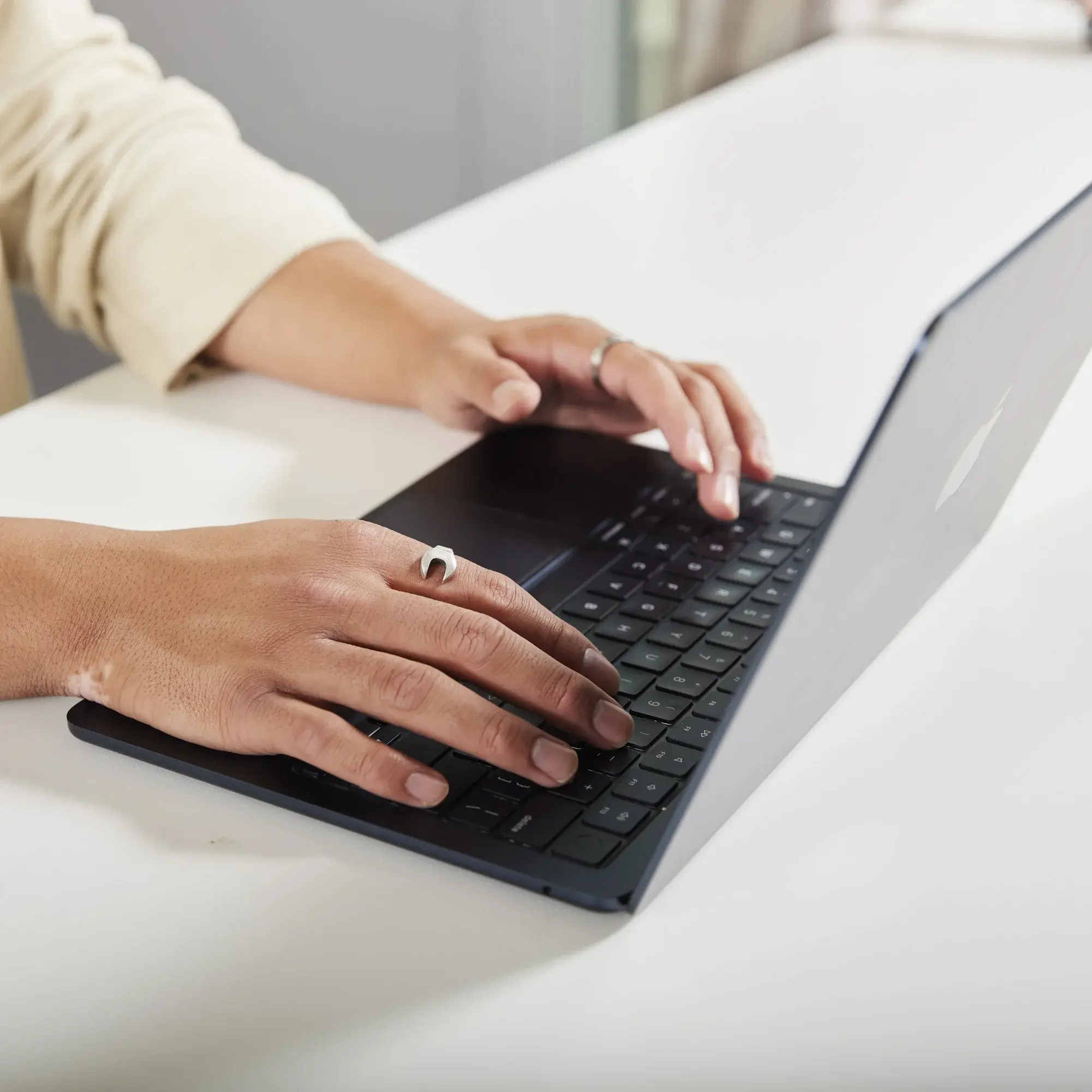 A person working on a laptop.