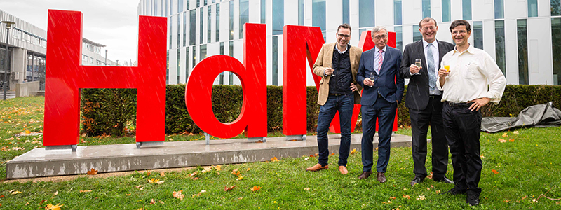 Prof. Dr. Bernhard Dusch, Peter Marquardt, Prof. Dr. Alexander W. Roos, rector at HdM, and Prof. Dr. Andreas Koch (from left to right) infront of the new letters, Foto: Florian Müller